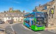 Bus stoping outside a pub