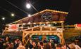 Visitors enjoying outdoor drinks at the Apline Lodge Bar in bournemouth