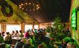 Guests enjoying cost festive scences upstairs in the tradional apline bar