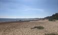 Highcliffe beach on a sunny day looking west towards Poole and Bournemouth.