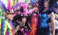 4 people dressed up in amazing colourful outfits in celebration of Bournemouths Gay Pride weekend