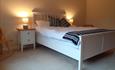 Bedroom with large bed and warm lights
