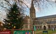 Exterior Cathedral with large decorated Christmas tree at the entrance