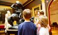 Children looking at the statues inside Russell-Cotes House, Gallery and Garden in Bournemouth, Dorset