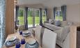 beautifully decorated dining room and living room with light decor Meadowbank Holidays