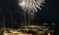Fireworks exploding over the boats in Poole harbour