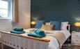 Bedroom with duckegg colour furnishings