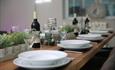 Dining table with plates and wine at Haven Road