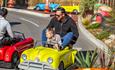People in tiny car