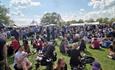 Crowd's of people sat around on the Quomps enjoying the sunny weather