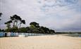 Wide shot of Avon Beach huts stretching out towards Highcliffe beach in the East.