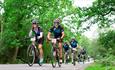 Group of cyclists riding on the road for Garmin Ride out