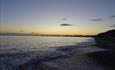 Highcliffe beach at dawn early morning sunrise.