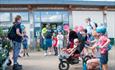 Families outside gift shop with nets