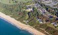 Arial view of Highcliffe beach with the castle sat in the background