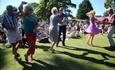 People dancing on the grass