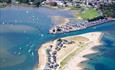 Mudeford spit shot from above, the harbour is full of activity