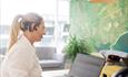 Estate Agent on the phone with a laptop